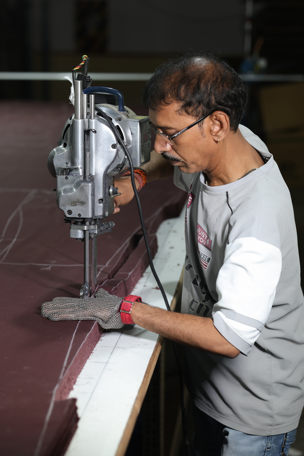 Cutting operator working on industrial fabric